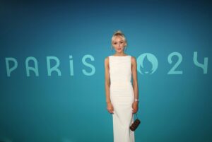 Nastia Liukin Instagram - What an incredible honor to have been asked to perform “Les Trois Coups”  last night at the Women’s Team Finals… Thank you so much @paris2024 🤍  It was truly the biggest honor. 

For those who aren’t familiar, “Les Trois Coups” is inspired by the tradition of French theater, to signify the start of a performance, that the show will begin shortly.. This local  tradition was carried over to the Olympics to open and being each competition and sport at the Paris 2024 Games. 

PS @johnkcheng with the ultimate framer of the night… without even realizing it in the moment – keep scrolling / zoom in far right to see my dad who happened to be trying to walk by at this exact moment to only be asked to please stop because someone was coming out of the tunnel - to then seeing me and mostly likely wondering what the heck I was doing walking into the arena of the olympic team final… in a DRESS lol
