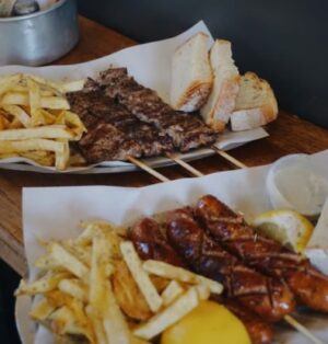 Nia Vardalos Instagram - When in Athens, a must is the skewers at @elviskalamakia! Walk the streets like a Greek: hold delicious hot & salted meat on a stick! 🍖 And a special shoutout to the owner who actually gave me the shirt off his back for a birthday present for my boyfriend! Tell me in the comments what to eat next using the hashtag #eatthis Thank you! 🇬🇷❤️🇬🇷#notanadjustafan #visitgreece #eatthis #greece #mybigfatgreekwedding #love #instagood