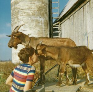 Nicholas Kristof Instagram - That’s me at 11 with my goats on our family farm. I dug up the photo because I wrote this weekend about a girl in California who raised a goat for 4-H, fell in love with it — and then was told by her county fair to give it up for slaughter. I think the little girl knew something many don’t: There’s no bright line between the pets we pamper in our homes and the “beasts” abused by factory farming systems in our barns.