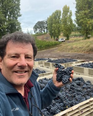 Nicholas Kristof Instagram - It’s Pinot Noir grape harvest day at @kristoffarms! Thrilling! One of the photos shows me with superb winemaker Adam Campbell of @elkcove and Jessica Dunham of @resultspartners — our heroes on a day like this. Our vines bow to them. Our first Pinot wine, from the ‘22 harvest, is maturing in bottles and will be ready to drink before long. We’ll be sending out info via our newsletter that you can sign up for at KristofFarms.com