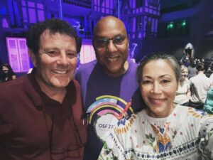 Nicholas Kristof Instagram - I first went to the Oregon Shakespeare Festival as a kid 51 years ago, and now I go every year with my family and a bunch of friends — a group of 29 of us this year. One of those friends is fellow journalist from Oregon @anncurry (who grew up in Ashland). The @osfashland festival, like lots of live theater, has struggled in recent years, but it has a terrific new artistic director, Tim Bond — and that’s Tim sandwiched between Ann and me with the set for Twelfth Night behind us (a wonderful production). We’re confident he’ll have the theater company thriving again soon and we’re cheering him on. The festival is so important for the culture and economy of the region — and it certainly enriches our lives each year.