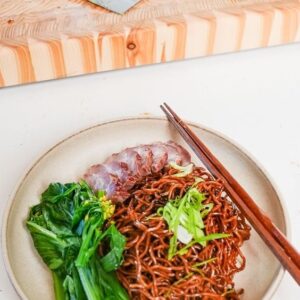 Nigel Ng Instagram - Wonton Mee 

Ingredients
- 1/2 bunch choy sum
- 2 spring onions, sliced
- 2 tbsp light soy sauce
- 2 tbsp dark soy sauce
- 1/2 tbsp sesame oil
- 2 cloves garlic, grated
- 1 tsp sugar
- 1/2 tsp white pepper
- 1/2 tsp MSG (optional)
- 2 bunches egg noodles
- char siu pork (optional)
- sambal, to serve

Method
1. Place a large pot of water on to boil.
2. In a bowl, mix together the soy sauces, garlic, sugar, sesame oil, pepper, and MSG.
3. Place the noodles into the boiling water and cook for 2 minutes. Remove and place into the sauce mixture.
4. Once the noodles are out of the water, add the choy sum to the boiling water and simmer for 2-3 minutes.
5. Mix the noodles well in the sauce, then serve with the shoy sum, char siu pork, and sambal. Enjoy!

#cooking #uncleroger #recipe #noodles