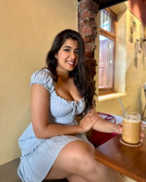 Nikita Sharma Instagram - A cute little dress, a pair of Jordan’s, and my cup of coffee makes for the perfect Bombay day out! 🩵