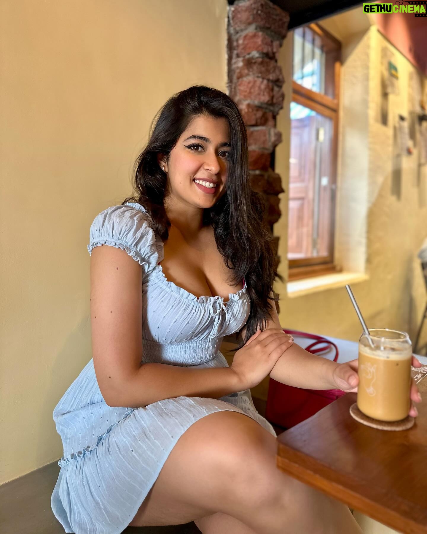 Nikita Sharma - 97.1K Likes - A cute little dress, a pair of Jordan’s, and my cup of coffee makes for the perfect Bombay day out! 🩵