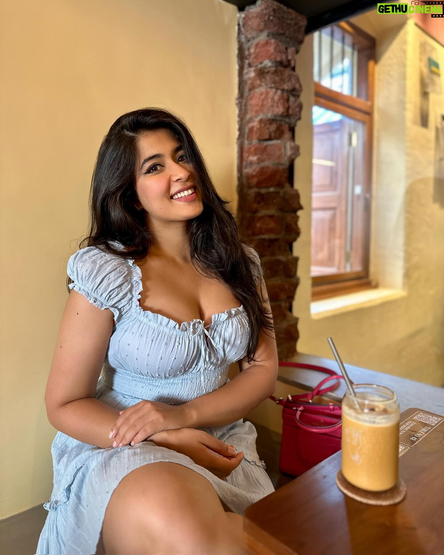 Nikita Sharma - 97.1K Likes - A cute little dress, a pair of Jordan’s, and my cup of coffee makes for the perfect Bombay day out! 🩵
