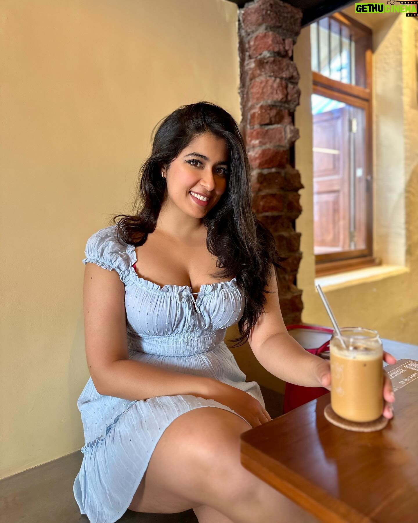 Nikita Sharma - 97.1K Likes - A cute little dress, a pair of Jordan’s, and my cup of coffee makes for the perfect Bombay day out! 🩵