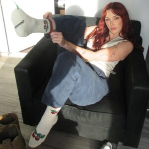 Olivia O'Brien Instagram - all a girl needs while traveling are cute socks and a blue haired best friend (blue haired best friend not included with purchase of socks!)