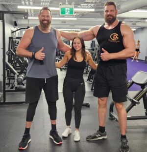 Olivier Richters Instagram - Done filming @reacherprimevideo season 3! Special thanks to @keil_zepernick my first stunt double who is 6'11"ft /2.11m 💪. Some stunts I just need to leave to a pro 😅. Cool fact: he played the first Venom and Thanos, motion capture for the fights. In the middle his daughter @emy_gotro. I'm back in the Netherlands, back to work at my online sports supermarket @musclemeatnl . And yes I hit all emergency exit signs with my forehead lol (middle of photo). #thedutchgiant #reacher #gym #stunts #fitness #bodybuilding #amazonprime