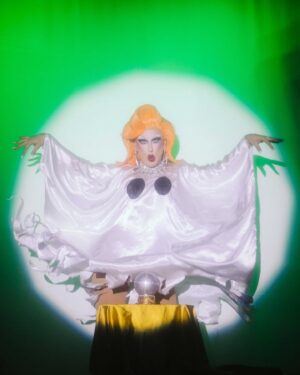 Pythia Instagram - Nightgowns was so magical! 🔮✨👻 I can’t believe this was my very first US performance and I got to share it with absolute icons @sashavelour @essanoche and @queenutica! 

On top of it all, this special night was the tenth sold-out show at @|prnyc and the 45th sold-out show in a row! What an HONOUR!!!
Together we also raised $6650 for Gaza which was distributed to 3 mutual aid funds, Crips 4 eSiMs, and @pal_legal. Thank you to @islynyc and @sorrelloriginals for providing raffle jewels!

Honest dream come true! Here’s to many more to come soon! 💕 

Pics by @sidewalkkilla @ajjordanphoto @matie
Orange wig by @itsheavengenderfck/@genderfcked.wigs 
Purple dress by @lucindamiu 
Ghost, Pearl outfit and seashell headpiece by me