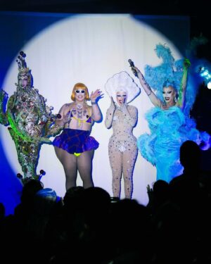Pythia Instagram - Nightgowns was so magical! 🔮✨👻 I can’t believe this was my very first US performance and I got to share it with absolute icons @sashavelour @essanoche and @queenutica! 

On top of it all, this special night was the tenth sold-out show at @|prnyc and the 45th sold-out show in a row! What an HONOUR!!!
Together we also raised $6650 for Gaza which was distributed to 3 mutual aid funds, Crips 4 eSiMs, and @pal_legal. Thank you to @islynyc and @sorrelloriginals for providing raffle jewels!

Honest dream come true! Here’s to many more to come soon! 💕 

Pics by @sidewalkkilla @ajjordanphoto @matie
Orange wig by @itsheavengenderfck/@genderfcked.wigs 
Purple dress by @lucindamiu 
Ghost, Pearl outfit and seashell headpiece by me