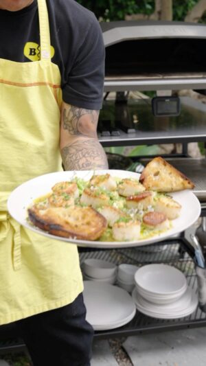 Roy Choi Instagram - ‘I’ve never been so excited about toasting bread.’ Amen to that! @Chefroychoi cooked up family-style seared scallops with salsa verde, spring veg, chili ponzu and garlic bread for dipping. This oven doesn’t play around. The results were 🔥