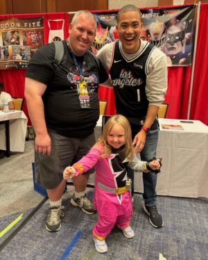Russell Curry Instagram - My @rangerstopandpop 2024 wrap up! 

Thank you to all of the fans and the amazing organizers for making my first Ranger Convention such an incredible time! 

Thank you to all my castmates and other fellow Rangers for being so gracious, kind and ready for some shenanigans! The Power Rangers family really is a FAMILY 🙏🏼

And last but certainly not least, thank you to @trippin_over_toys aka Tyler aka the best volunteer right hand man I could've asked for! He went absolutely above and beyond in making sure things went as smoothly as possible for myself and everyone who came to our booth. AND he even took all these dope candid pics so I could have even more memories of my first con 🙌🏼

If you're into collectibles, especially action figures, give his page a follow. Tons of great stuff on there! 

I can't wait for the next one! See you all soon 😉

PS Tyler didn't ask me to shout him out, he's just an awesome dude and deserves the love!