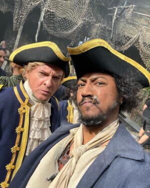 Samba Schutte Instagram - Today’s Crew Shoutout: our charismatic captain @rhysiedarby aka Stede Bonnet🏴‍☠️ Rhys is a true master improviser and master of his craft. Uniquely playful, even doing different characters in his down time☠️ Part 1 cos there’s too many fun moments to share🖤⚔️ 
#OurFlagMeansDeath #ofmdseason2 #ourflagbbc #bts