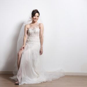Sarah Lian Instagram - Couldn’t be more in love with this wedding gown by @syomsz @syomirizwagupta. Featuring an asymmetrical neckline with illusion panels and a corseted bodice, this dress had a silk chiffon skirt that was incredibly light, with a sexy high slit for ventilation. 

It had all the details I wanted without looking over the top and yet a traditional white with beautiful floral motif lace overlayed to create depth with textures. With hand sewn appliqués on both my veil and dress (by Martin and Syomzs), this was 100% made with love. 

Most of my meetings with Syomir was 1:1 and there’s no one else I would have wanted to create this special piece that will be etched forever in my memory. Syomir, I love you and I’ve never felt more Yan Sow Lin in my life! Thank you for creating this with me. ❤️❤️❤️

Pino- we finally made it happen!!! Kakak dah kahwin! 

📷: @pinography 

#syomirizwa #weddinggown #thetingtengs #bespokedesign