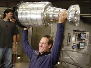 Scott Bakula Instagram - Before the Cup made it to St. Louis and the Enterprise Center, it made it into space on the USS Enterprise thanks to Luc Robitaille! Plus my buddies Steve Duchesne and Brendan Shanahan( former Blues players!)