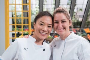 Shirley Chung Instagram - 🔥🔥🔥 Are You ready for our Rematch?! @chefbrookew 🐽🐷🫘 📺This Tuesday July 16th 9pm on @foodnetwork , I will be taking on the Titans!  will be cooking against friends, Tiffany and Michael, for the very first time ❤️ but I am most looking forward to compete against my good friend, old roomie, my bunk bed mate Brookie for the first time since our Top Chef finale 8years ago! 👊  Look, we even have the same pose standing in front of our judge @geoffreyzakarian.  Can you guess what we will be cooking in our rematch? 😉  Hint, we def have a little history on the ingredients 🤔. Premiering Tuesday, July 16th at 9pm – “Titans vs Shirley Chung”
Chef Shirley Chung has a bone to pick with Bobby Flay’s Titans — especially her former roommate, Brooke Williamson. While Shirley’s intimate knowledge of the Titans could lead to their downfall, Iron Chef Geoffrey Zakarian’s judging keeps everyone on their toes.
 
#BobbysTripleThreat @foodnetwork @StreamOnMax #chefshirleychung #dumplingmafiaqueen