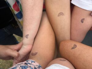 Suzi Ruffell Instagram - A wonderful time at Brighton Pride with my best girls. 
Yes we did get matching rainbow tattoos.
🌈