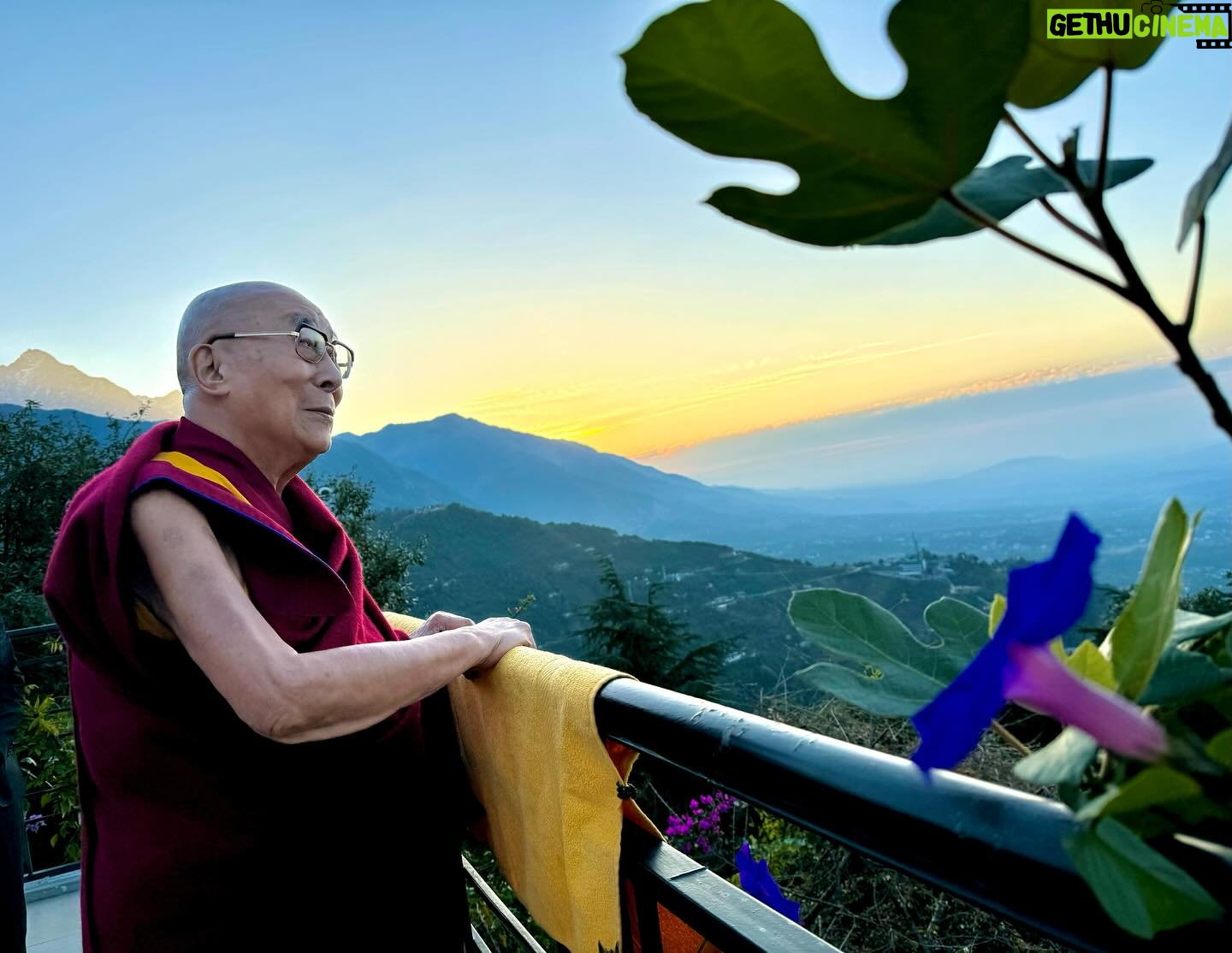 Tenzin Gyatso - 74.3K Likes - HHDL enticed by the dawn, takes joy in the simple beauty of flowers and the sunrise from his balcony. Photo by Ven. Tenzin Jamphel #dalailama #dharamshala