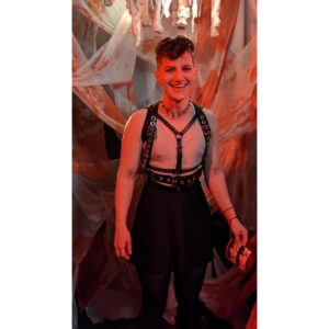 Theo Germaine Instagram - Carrying on our Halloween tradition of dressing like backup dancers for Pinhead 🪡🎃🕸⛓️🫀 thanks @piercedbyrylan for being our guardian angel 👼🏼 image descriptions in alt text! there's also a spelling error in my poem - it should be smokemachine / not "smokeachine" 😹