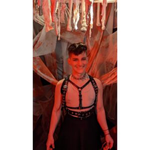 Theo Germaine Instagram - Carrying on our Halloween tradition of dressing like backup dancers for Pinhead 🪡🎃🕸⛓️🫀 thanks @piercedbyrylan for being our guardian angel 👼🏼 image descriptions in alt text! there's also a spelling error in my poem - it should be smokemachine / not "smokeachine" 😹
