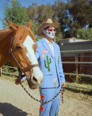 Todd Smith Instagram - Cowboy Clown @todderic ⭐️
Photographer: @carianneolder 
Producer: @polderexpress
Videographer: @bysammismith
Makeup: @downtoclownmakeup
Stylist: @brandenruiz
Custom suit: @stonedbymegs
Boots: @pskaufman 
Location: @lilbarnridingschool
Shot on @kodakprofessional #kodak200