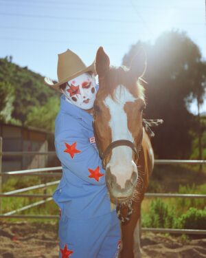 Todd Smith Instagram - Cowboy Clown @todderic ⭐️
Photographer: @carianneolder 
Producer: @polderexpress
Videographer: @bysammismith
Makeup: @downtoclownmakeup
Stylist: @brandenruiz
Custom suit: @stonedbymegs
Boots: @pskaufman 
Location: @lilbarnridingschool
Shot on @kodakprofessional #kodak200