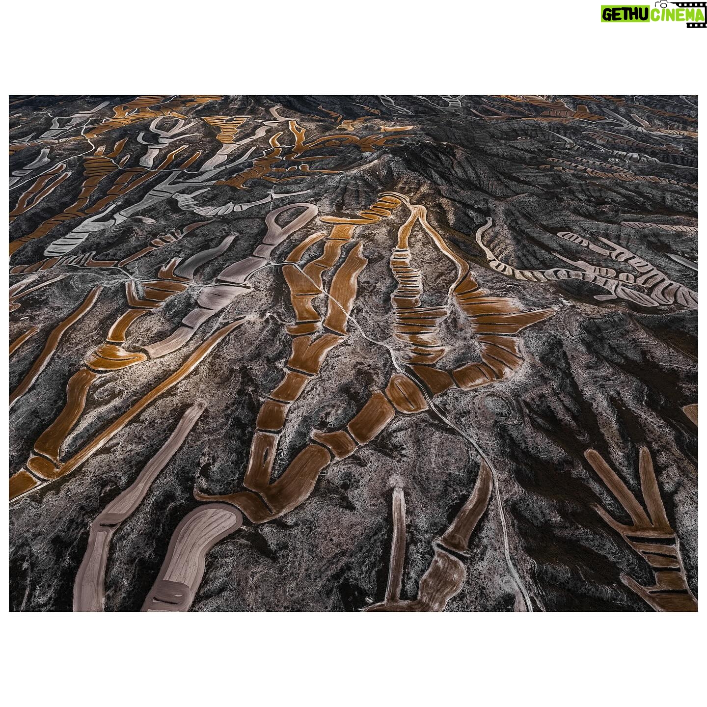 Tom Hegen - 858 Likes - New Series release – The Spanish Farmland Series II
In this aerial series, I explore the stunning landscape of agricultural fields in central Spain. Over centuries, Spanish farmers transformed the landscape into a patchwork of abstract art. They adapted to the rugged topography by carving tracks, fields and plantations into the terrain.
Even though the soil is quite fertile, cultivating the fields is challenging due to increasingly low rainfall and extreme heat. For that reason, the fields are organized in terraces to prevent rainwater from flowing off. Some fields are still cultivated, while others have been abandoned due to excessive labour and low yields.
Seen from the air, the landscape resembles a subtle arrangement of blood cells, ordered into a patterned carpet covering the surface.
I’m interested in finding the most abstract forms of human-altered landscapes—places where the transition from photography to painterly images is fluid. However, farmers on the ground are the actual designers of the images, supposedly with an economic rather than an artistic intention. I see myself as the observer, curating their work into artworks with a subtle eye.