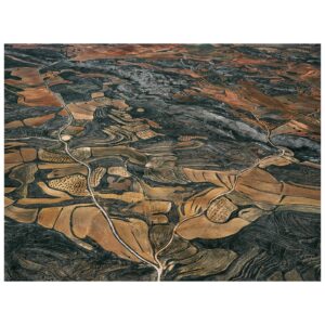 Tom Hegen Instagram - New Series release – The Spanish Farmland Series II 

In this aerial series, I explore the stunning landscape of agricultural fields in central Spain. Over centuries, Spanish farmers transformed the landscape into a patchwork of abstract art. They adapted to the rugged topography by carving tracks, fields and plantations into the terrain. 

Even though the soil is quite fertile, cultivating the fields is challenging due to increasingly low rainfall and extreme heat. For that reason, the fields are organized in terraces to prevent rainwater from flowing off. Some fields are still cultivated, while others have been abandoned due to excessive labour and low yields.

Seen from the air, the landscape resembles a subtle arrangement of blood cells, ordered into a patterned carpet covering the surface. 

I’m interested in finding the most abstract forms of human-altered landscapes—places where the transition from photography to painterly images is fluid. However, farmers on the ground are the actual designers of the images, supposedly with an economic rather than an artistic intention. I see myself as the observer, curating their work into artworks with a subtle eye.