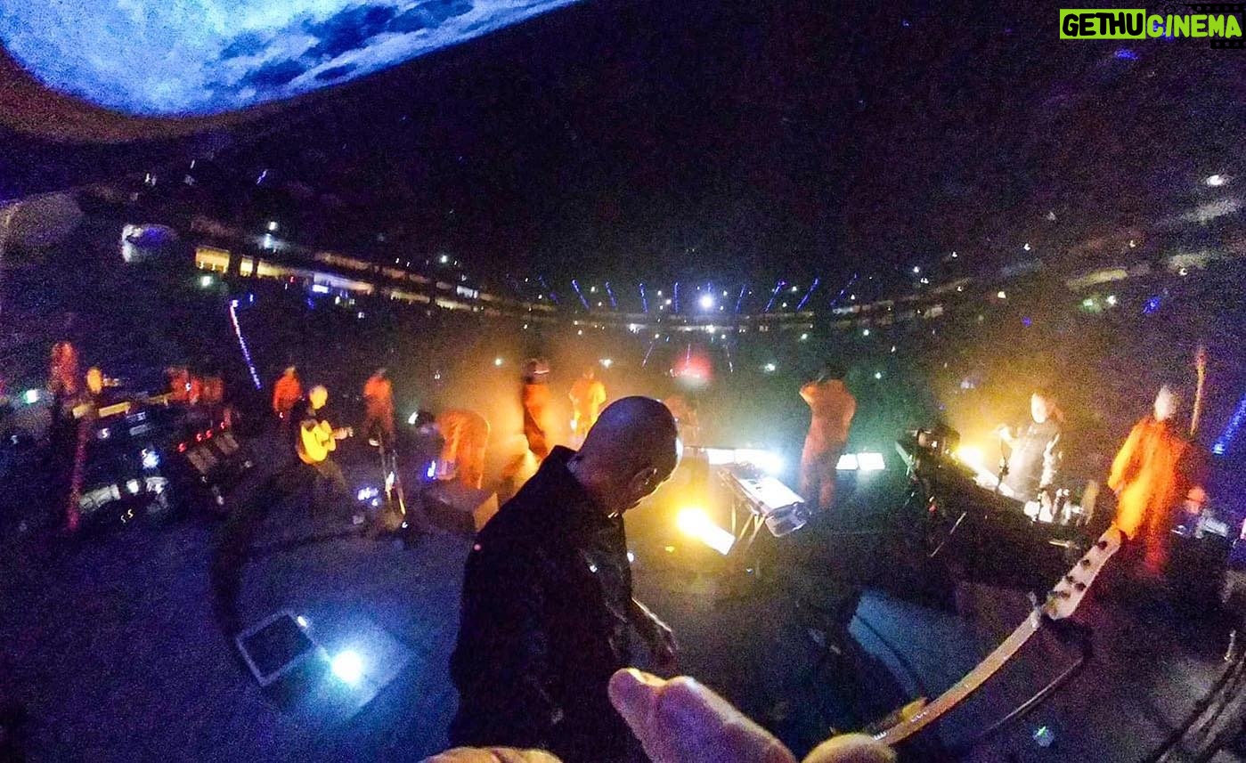Tony Levin - 2.3K Likes - This pic from last night in Cologne looks more like a horror movie than a show. Men in orange march towards me as the huge moon is about to collide with earth. #petergabriel