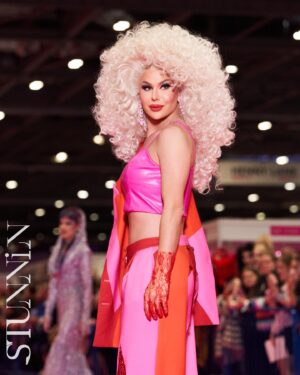 Trinity the Tuck Instagram - What an incredible weekend at @rupaulsdragcon UK! Thank you all who came to visit me at my booth! It was my pleasure to talk to each of you! Thank you to my team of Tuck Support who helped facilitate such a professional and easy work space! I’ll see you at the next one ! Hair by the incredible @baehmbaehmwigs suit embellished by @natalia_at_nite and the amazing blue jacket by @mr_riegillio . Jewels by @ampedaccessories . Photo credit by @stunnin.mag and @gettyimages