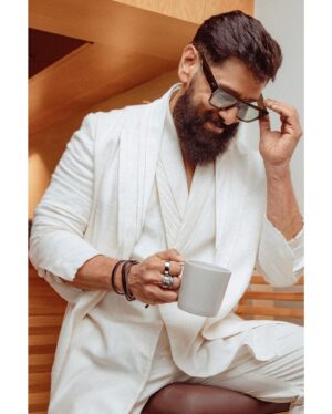 Vikram Instagram - In a world of colours, be the shining white.  Styled by @ishabhansali. 📸 @puchi.photography. Outfit @antar_agni_ujjawaldubey
Accessories @ishhaara 
Sunglasses @rosvinbugs 
Shoes @whitemuds_official #thangalaanfromaug15