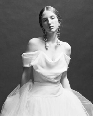 Vivienne Westwood Instagram - The Nova Cocotte was originally designed for the Autumn-Winter 2005/06 collection, Vive La Cocotte.  For 2024, the style has been reimagined, offered in a pearl white heavy silk satin fabric, or in silk cady - for brides who prefer a fabric with a more subtle shine. The gown is styled here with the Joe Petticoat in tulle, for added volume, transporting the bride from day to night.⁠
⁠
Book your exclusive 2025 Bridal Trunk show appointment, on the following dates:⁠
⁠
Los Angeles: October the 10th – October the 28th⁠
London: October the 14th – October the 26th⁠
New York: November the 1st – November the 19th⁠
Milan : November the 4th – November the 18th⁠
Paris: November the 22nd – the 7th of December⁠
⁠
#VWBridal #WestwoodBridal