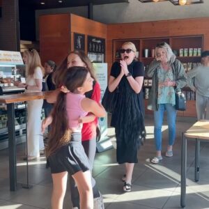 Alice Evans Instagram - It all began as just a regular walk to school..

Since Wednesday is late start, and Friday is Elsie’s birthday, I suggested we stop off at Starbucks on the way as a special treat. All the way there she talked about the chocolate Frappuccino she was going to order. 

Little did Elsie know that the amazing Mums and Dads ( and kids!) in our little circle had wanted to make the quick stop at Starbucks just a little bit more special…. ❤️

#imnotcrying #maybeabit  #theypulleditoff #ittakesavillage #grateful #happybirthdayfriday13th  #happybaby