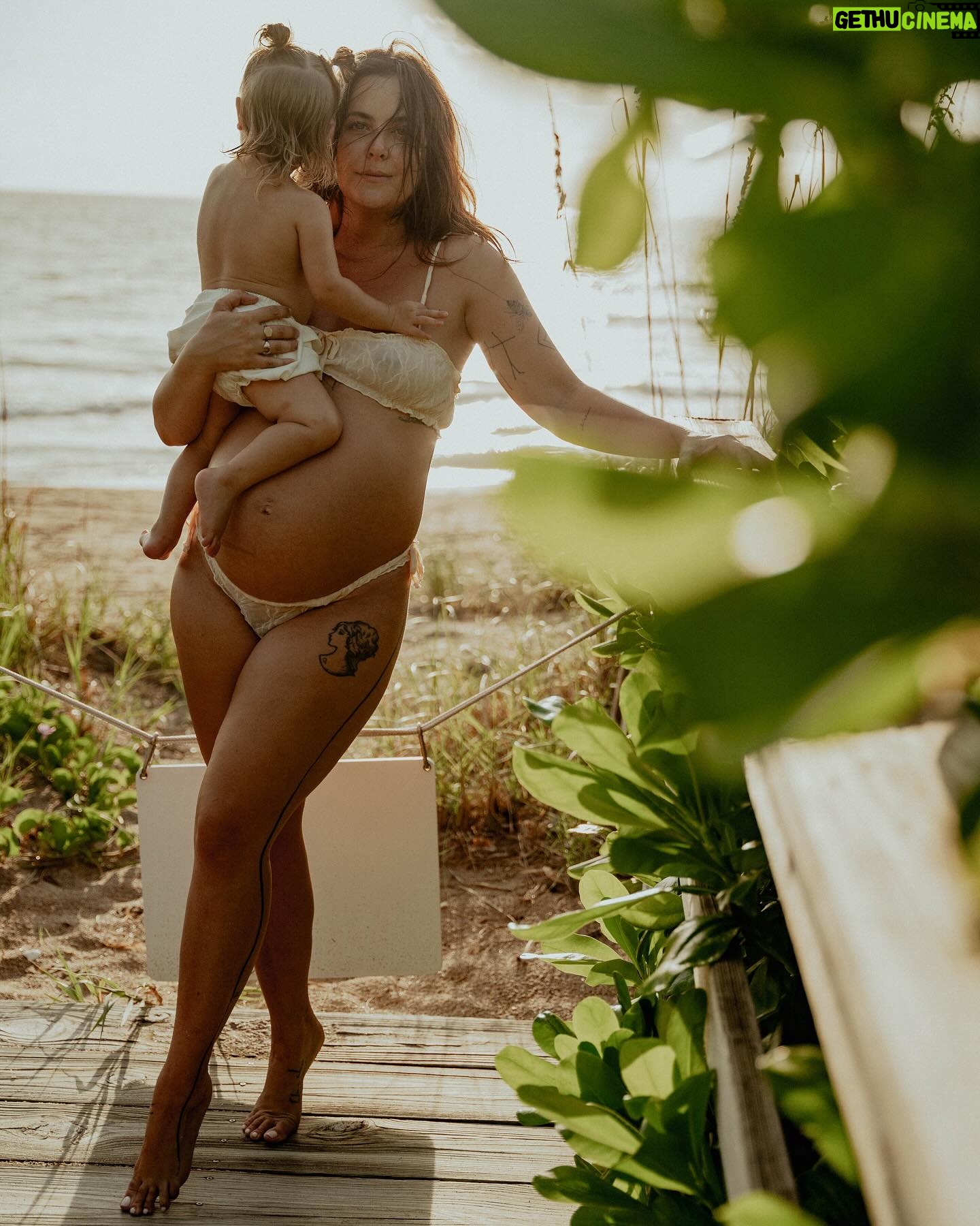 Bethany C. Meyers - 16.2K Likes - Sharing the best photos I’ve ever taken in my entire life. Please enjoy round 1 from our maternity shoot.
This is our little boardwalk to the beach. When we first moved to Florida in January, Kilmer was 10 months old. Each time we went to the beach, I would let her crawl down the boardwalk and think to myself, soon she’ll be running down this thing.
I just so happened to get pregnant the same day we moved to Florida. And soon, she was running and I began to envision pregnant me walking with Kilmer down this path. And lately the visions have shifted to holding a newborn in one arm and Kilmer’s hand with the other while making our way to the ocean.
This little boardwalk has become a special place. Big blue crabs often hide in earth surrounding us. We’ve seen snakes and birds and all kinds of critters that have made it a fun stop. It’s the shade from the sun, the place we swat mosquitoes and the spot where we strip down and wash the sand off our body while playing in the hose water.
I wanted pictures with her here so badly and @createanomaly made that dream come true. I’ll always think fondly on these special moments together. Life before two. Just me and my first in barefoot exploration.