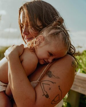 Bethany C. Meyers Instagram - Sharing the best photos I’ve ever taken in my entire life. Please enjoy round 1 from our maternity shoot. 

This is our little boardwalk to the beach. When we first moved to Florida in January, Kilmer was 10 months old. Each time we went to the beach, I would let her crawl down the boardwalk and think to myself, soon she’ll be running down this thing. 

I just so happened to get pregnant the same day we moved to Florida. And soon, she was running and I began to envision pregnant me walking with Kilmer down this path. And lately the visions have shifted to holding a newborn in one arm and Kilmer’s hand with the other while making our way to the ocean. 

This little boardwalk has become a special place. Big blue crabs often hide in earth surrounding us. We’ve seen snakes and birds and all kinds of critters that have made it a fun stop. It’s the shade from the sun, the place we swat mosquitoes and the spot where we strip down and wash the sand off our body while playing in the hose water. 

I wanted pictures with her here so badly and @createanomaly made that dream come true. I’ll always think fondly on these special moments together. Life before two. Just me and my first in barefoot exploration.