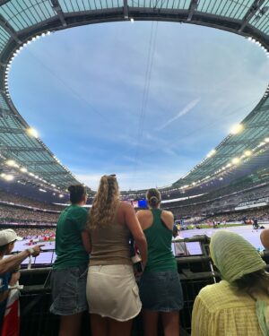 Brooke Boney Instagram - I had friends come visit who I managed to squeeze in hugs and fun with in between doing crosses and spending time with the families of the athletes. @cstanaway shouted our team a family feast from French KFC on a 35 degree day in an hour between rugby matches at the Stade de France. I watched brothers and sisters cheer on their siblings even though they didn’t place because they were so frigging proud they got as far as they did. We took naps on the floor between broadcasts because we were glued to the coverage and couldn’t leave the compound because security was so tight 🇫🇷