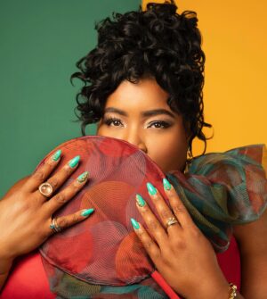 Dulcé Sloan Instagram - In the first of the Emmys posts I present THE LOOK!
Thank you to everyone who made this possible 

Gown: @anit_cuts 
Pearl Earrings & Ring: @zepplinthelabel 
Gemstone Earrings & Rings: @inthelightofdayjewelry 
Necklace & anklet: @madebymooni 
Pinky ring: @gabrielandco 
Bracelet: @trinaturk vintage
Shoes: @naturalizer 
Bag: @meliebianco 
Stylist: @styleethic 
Hair: @misscopeland310 
Makeup: @jenfregozo 
Lip Color: “I’ll Show You Crazy” by @giggleglosslips 
Nails: Tran of @pamperedhands 
Photos: @kimnewmoney