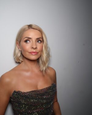 Holly Willoughby Instagram - Amazing evening at the NTA’s - huge congratulations to all the winners 🤩

Thank you to my glam team @danniiwhitemanstylist , @cilerpeksah_hairstylist and
@patsyoneillmakeup

Dress by @kolchagovbarba
Jewellery @astrealondon
Bag by@emmylondonofficial 
Shoes @Stuartweitzman
Makeup - @beautypie - full list of products used on their insta