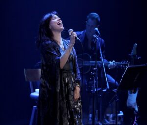 Imelda May Instagram - I was incredibly honoured to be invited 
to perform a show in celebration 
of the great Lady Augusta Gregory 
in the @abbeytheatredublin last night.
Lady Gregory was such an important figure in Ireland 
not least as a great poet and playwrite but also as an active researcher, collector. preserver and translator 
of our old and rich oral traditions which 
without her might well have been forever lost. 
She was one of the founder members of 
the Abbey Theatre itself and a leading figure 
in the Irish revivalist movement.
I was delighted to meet with Lady Gregory’s family especially her great granddaughter Jane Murray-Brown
Thank you to all the incredible team at The Abbey, 
my wonderful manager @meredithplant1 
and of course my talented band 
@richardjcardwell on piano and @guitardarling on guitar 
who player such an important part 
of a very special evening. 
Thank you to all who came and trusted in me 
to create this celebratory and beautiful night.
But mostly thank you to the late great Lady Gregory 💚

Artistic Director Caitríona McLaughlin 
Executive Director Mark O’Brien
Resident Director Esosa Ighodaro
Producer Jen Coppinger
Casting Director Barry Coyle
Director of New Work & Literary, Ruth McGowan
Abbey Archivist Mairead Delaney 
Marketing Heather Maher
Socials Eva Louise
Artist Liaison Aoife McCollum
Technical Director Rob Furey
Production Manager Justin Murphy 
Sound Engineer Alexis Nealon
Monitor Engineer Derek Conaghy
Lighting Director Simon Burke
Lighting Tech Laura Honan
Stage Manager Pat Dillon

 
Dress & Cape by Sara ONeill
@saraoneillartist 🖤

Photographer Mark Stedman @mark_stedman