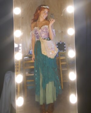 Jodi Benson Instagram - When Delaney was 4 yrs old, I brought her up on stage with me during my concert. I did a little interview with her before I started to sing my song “Part of Your World”. I asked her what she wanted to be when she grew up. She very quickly and confidently took the mic out of my hand and said , “I want to be Ariel when my Mommy dies!” Of course the audience broke out in laughter and so did I. She then started singing my song and didn’t really want to give the mic back to me. 
I knew in that moment that Delaney would one day become Ariel. 
My sweet girl, you truly were born to play Ariel. You made her your very own. You were so brilliant. You infused your joy, your humor, your passion and your love into every moment of her story.
It’s hard for me to find the words to express how I felt as I watched you on stage. I was and am so incredibly proud of you. Your vulnerability, strength, grace, courage, authenticity & confidence brought me to tears. Your voice was stirring & stunning and your version of “Part of Your World” was filled with such passion & determination. 
I love you, Delaney🩵
I’m honored to pass my treasured dinglehopper to you. 
You are, and always will be, my Ariel🧜‍♀️

…oh, and I’m so thankful I was still alive to see you become Ariel!😂
