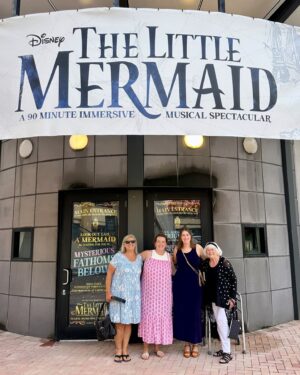 Jodi Benson Instagram - When Delaney was 4 yrs old, I brought her up on stage with me during my concert. I did a little interview with her before I started to sing my song “Part of Your World”. I asked her what she wanted to be when she grew up. She very quickly and confidently took the mic out of my hand and said , “I want to be Ariel when my Mommy dies!” Of course the audience broke out in laughter and so did I. She then started singing my song and didn’t really want to give the mic back to me. 
I knew in that moment that Delaney would one day become Ariel. 
My sweet girl, you truly were born to play Ariel. You made her your very own. You were so brilliant. You infused your joy, your humor, your passion and your love into every moment of her story.
It’s hard for me to find the words to express how I felt as I watched you on stage. I was and am so incredibly proud of you. Your vulnerability, strength, grace, courage, authenticity & confidence brought me to tears. Your voice was stirring & stunning and your version of “Part of Your World” was filled with such passion & determination. 
I love you, Delaney🩵
I’m honored to pass my treasured dinglehopper to you. 
You are, and always will be, my Ariel🧜‍♀️

…oh, and I’m so thankful I was still alive to see you become Ariel!😂