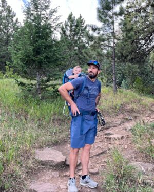 Meagan Martin Instagram - One of our favorite things to do these days are family hikes! Indy absolutely loves being outside and in the hiking backpack! Can’t wait for more of this as the fall temps roll in. Brought a post hike treat that always hits the spot @athleticbrewing 🍻! #brewwithoutcompromise