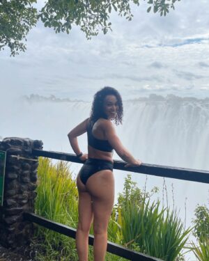 Pearl Thusi Instagram - My version of TLC is chasing water falls … 🌊
Waterfall rain hits different… the drip is crazy!

PS. Hope to have another adventure with you @chlomoolala 🤞🏽🤍

Would you love to visit Victoria falls?
