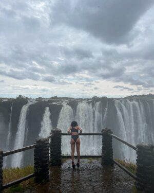 Pearl Thusi Instagram - My version of TLC is chasing water falls … 🌊
Waterfall rain hits different… the drip is crazy!

PS. Hope to have another adventure with you @chlomoolala 🤞🏽🤍

Would you love to visit Victoria falls?