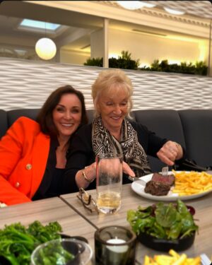 Shirley Ballas Instagram - Feeling so very special and loved as I head into 64 years of life ❤️ … thank you to each and every one of you for the beautiful messages, the beautiful flowers and handwritten cards, there was a lot today. I’ve been inundated with the most fantastic kind messages. I truly feel so blessed. You are all so kind. 

To all my friends and those I consider family I couldn’t do life without you. Thank you for all the support over the years. To my dearest mother who is by my side 24/7. Thank you for everything you do, I love you so very much. You’re my hero. I love you more than you love @marksandspencer lol. I missed my beautiful son @markballas, my daughter in law @bcjean and my amazing grandson Banksi, but I’ll sure see you all soon. 

Just wait till you all see what we got up to today. We had an absolute hoot and it was the perfect way to spend my birthday. As I write this we’re tucked up in bed watching Corrie ❤️ have a beautiful evening everyone. Hugs. X