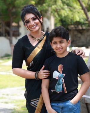 Sujitha Instagram - Mom and son in black 🖤😎

He provided great support for my cooking in a naughty way @dhanwindan 

Saree and dhanwin’s t-shirt @thanvi_design_studio 
Blouse @thanvi_boutique 
Make up artist @murugeshmakeup_hair 
Hair stylist @durga_hair_stylist 

#vijaytelevision #cooking #cookwithcomali #son #love #mother #instalike #instagram