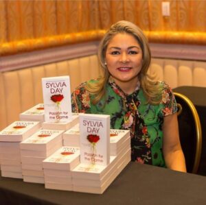 Sylvia Day Instagram - Exciting events are coming soon, DAYdreamer! I always look forward to visiting with you and signing your books! ☺️⁠
⁠
#Throwback to when I was waiting for the doors to open so I could sign copies of PASSION FOR THE GAME! Who has one? I love personalizing our favorite stories for you and I’m forever grateful when I can do so face-to-face! 🖤⁠
⁠
✨ Comment ATTEND and I’ll share my events calendar with you! ✨⁠
⁠
I’m so excited for what’s coming up and to see your faces soon! ⁠
⁠
xoxo,⁠
Sylvia⁠
.⁠
.⁠
.⁠
.⁠
.⁠
.⁠
.⁠
#event #throwbackthursday #tbt #writersofig #writerslife #kindle #writersofinstagram #authorsofinstagram #writer #bookish #passionforthegame #instabook #booklover #booksbooksbooks #reading #bookworm #booklovers #bookaddict #bookcommunity #booklove #instabooks #igreads #booksofinstagram #sylviaday #events #kindleunlimited