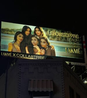Aryaana Gandhi Instagram - umm remember when this happened?!?!!!🤪 
cute lil backstory: when we first moved to LA, we lived in a small apartment directly across that billboard. we would look at it daily but never in our wildest dreams would we have imagined we’d be up there in a few years (!!!!!) when we heard about one going up, we had no idea where it was going to be placed. it wasn’t until we arrived at the location that we realised where exactly we were standing. it just so happened to be across that very same apartment. full circle, pinch me moment! ❤️
stream the tribe to watch the whole scene 🫶
#thetribeonprime