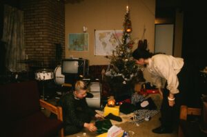 Kathy Kelly Instagram - Treasure from family Christmas archive!
A few days ago I discovered these pictures from my private family archive. Looking at them they brought so many old and emotional memories up..🥹
One can see from the tree that we did not have much.. and yet we three little women try our best with the little means we had to prepare for the “small ones” the Christmas presents and decorate the tree on the night before while “the small ones” are asleep. 
We tried to fill that void that Mother left when she died in any possible way. 
We tried our best to nurture and spread love so they may not miss anything. 
I believe this was in Holland in a Ferienwohnung shortly before we bought our boat “Sean O’ Kelly“. The gifts we bought in the flea market (we could not afford anything new) we wrapped them in any paper we could find (including toilet paper at times) and put the presents under the Christmas tree.
Kathy was and still is my hero and role model!! 
Barby..I can’t express what I feel.. it just breaks my heart to see her in this photo.
I am proud of my sisters and of myself. We did our best in very, very difficult circumstances and came out of it strong. 
I am so grateful to have lived such a rich life full of Love, and experiences in so many different ways. 
I am forever thankful to you Kathy my dear sis.. you stuck by me then and you stand by me today no matter what. I love you more then words can express!
Our love is unbreakable!
The best is yet to come sis!!♥️💪🎄🌟🎄🎄
Merry Christmas everyone! 
Do you have special memories of Christmas in the past? Write then down in the comments 🤩♥️