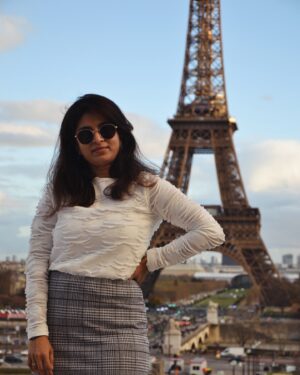 Mithra Kasthurirangan Instagram - Photoshoot that manifested 🤩 In front of the Eiffel Tower. Truly surreal! Making it to the city of love, hot chocolate, croissants, and fashion 🖤 Though Paris has its own dark side, this shoot was a dream come true—a gift to myself I’ll always cherish.

Ootd details 
Skirt - @hm 
Top - @styleunion.in 
Shoes - @aldo_shoes 
Parka - @zara 
Stockings - From airport duty free